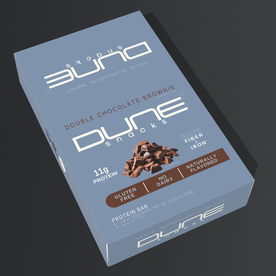 Dune Snacks Double Chocolate Brownie protein bar packaging on a dark background