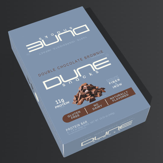 Dune Snacks Double Chocolate Brownie protein bar packaging on a dark background